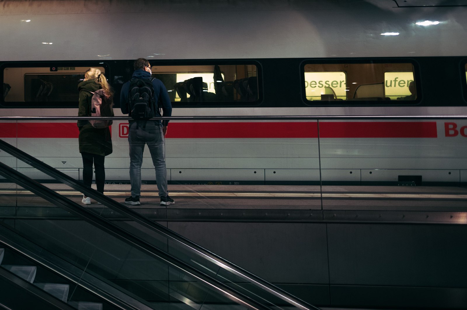 Railway platform with waiting passengers