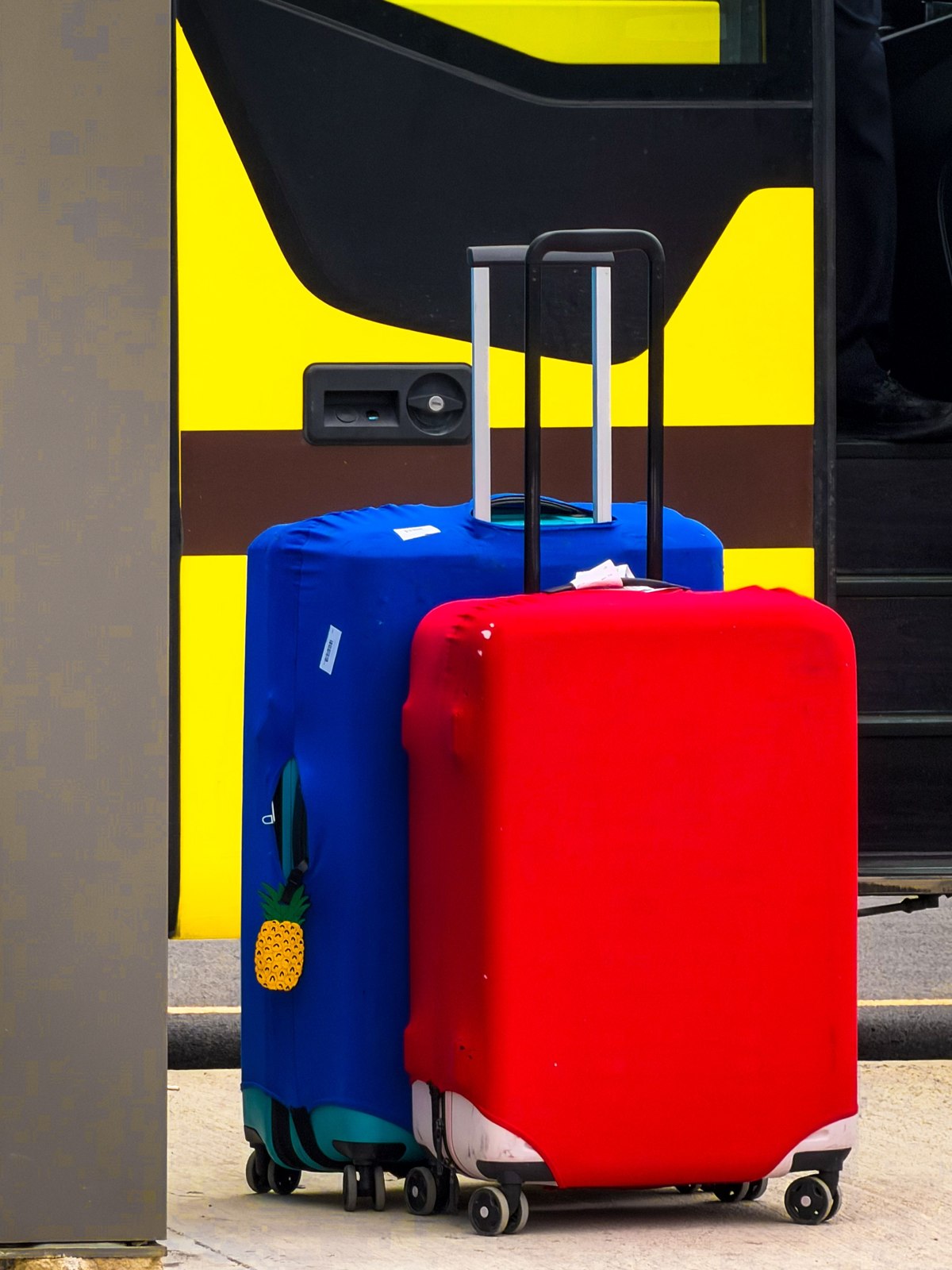 Suitcases beside a touring coach