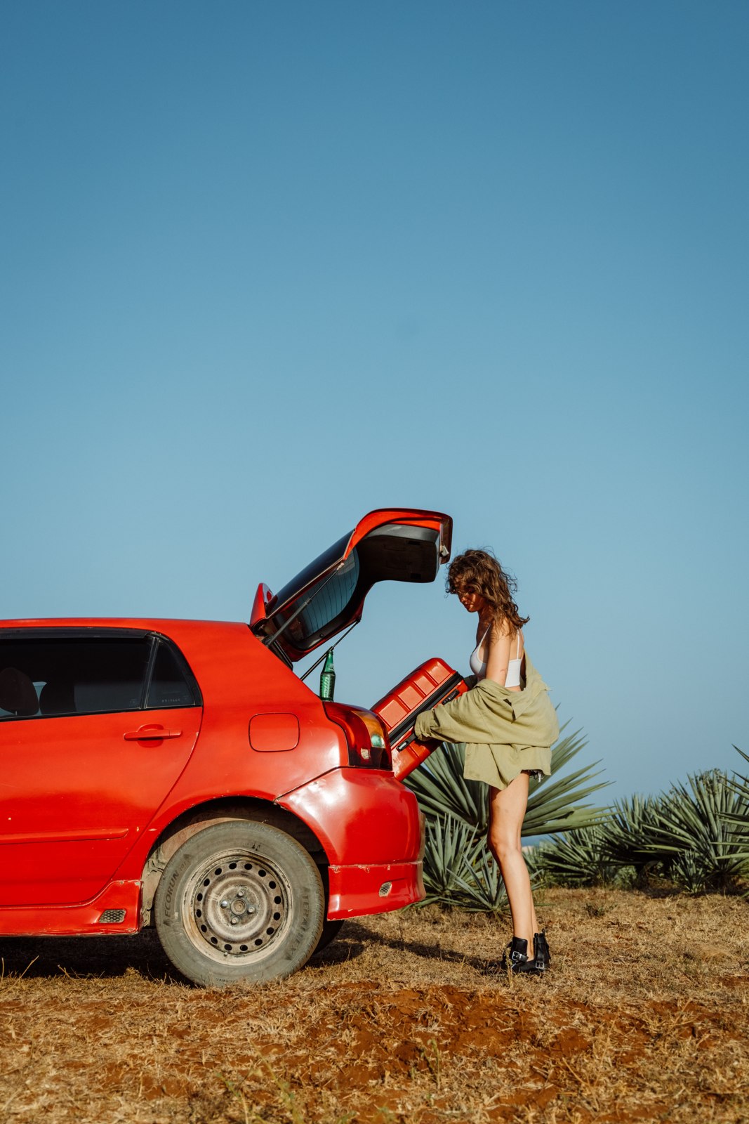 Placing luggage in a car boot