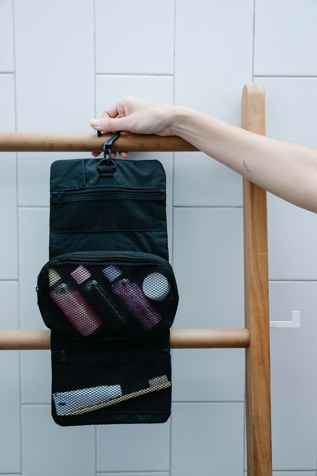 Hanging wash bag on a wooden rack
