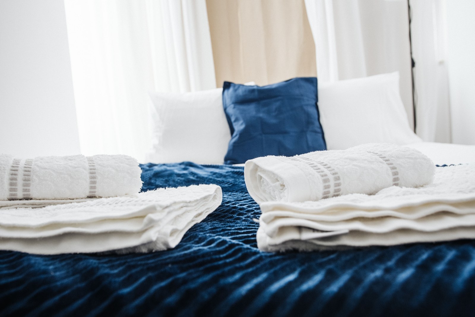Clean towels on a hotel bed