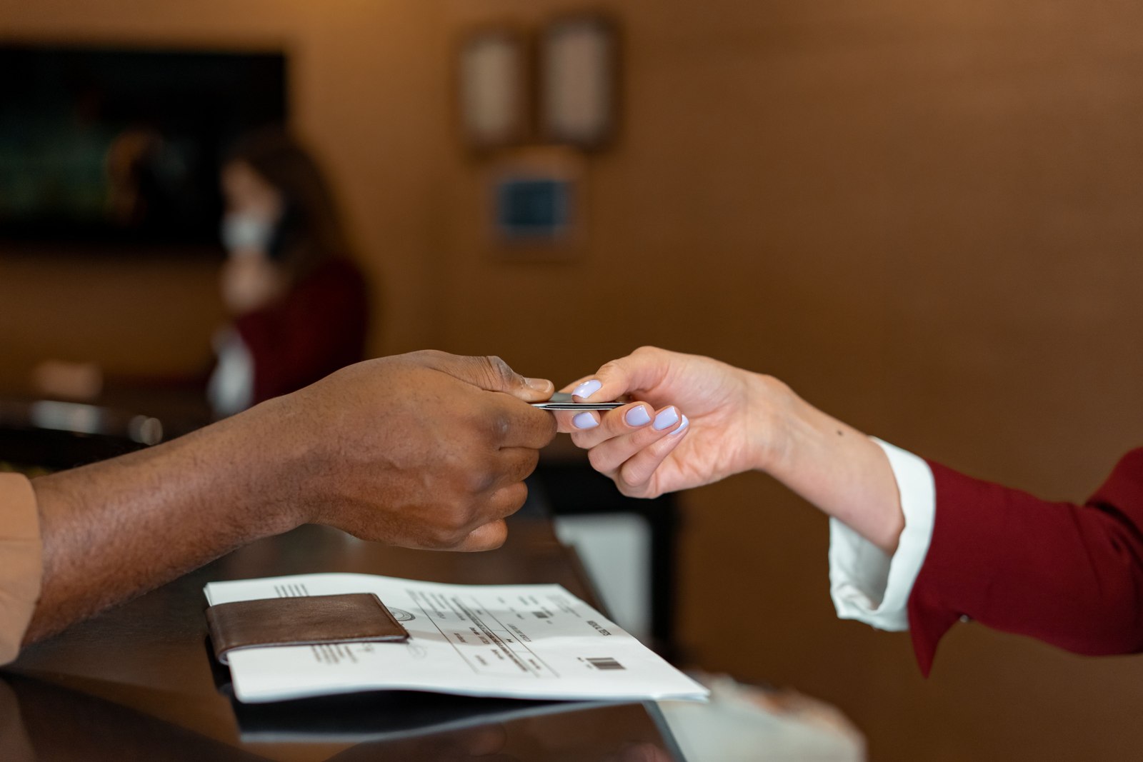 Payment at a hotel reception desk