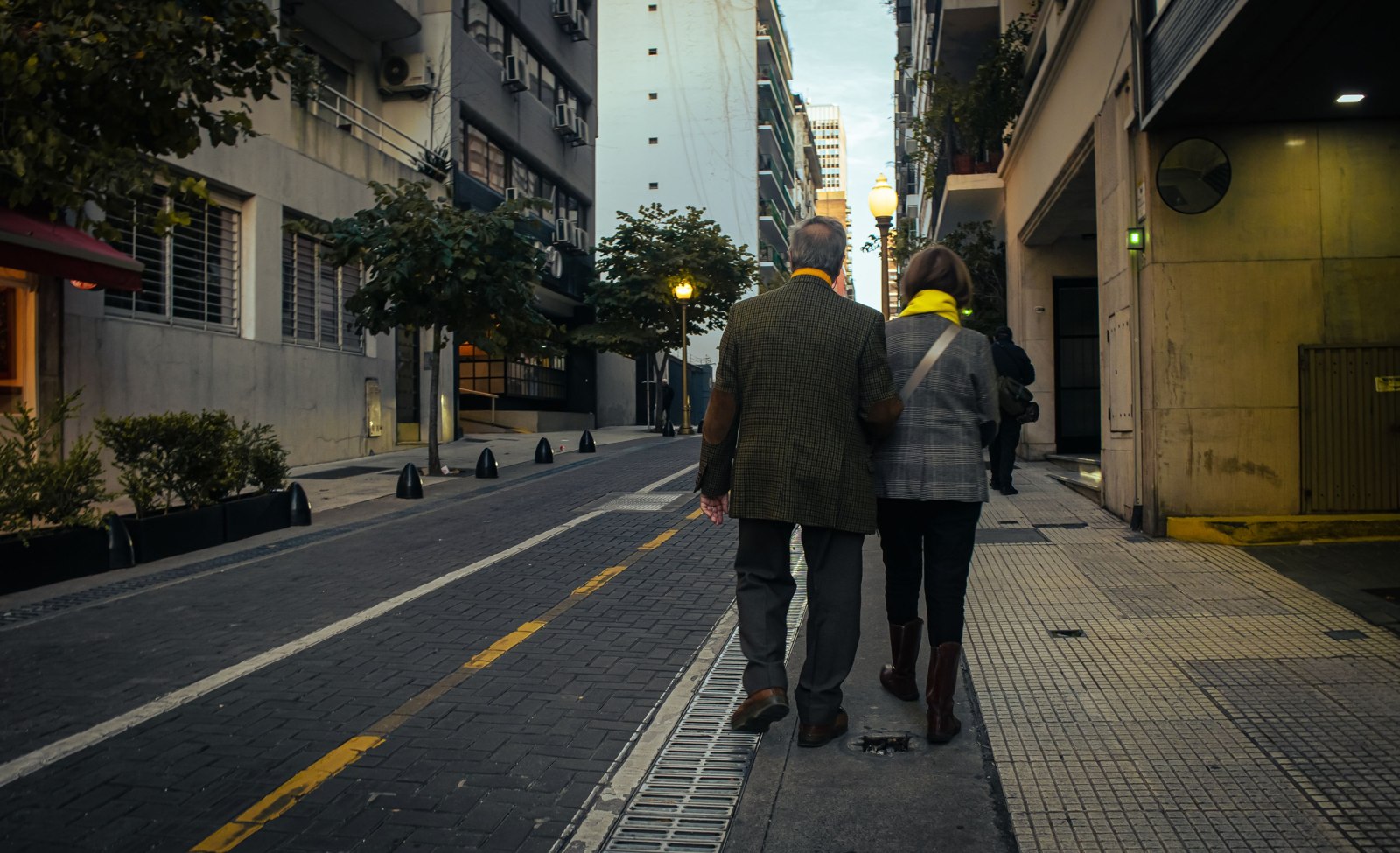 Older couple walking in a city